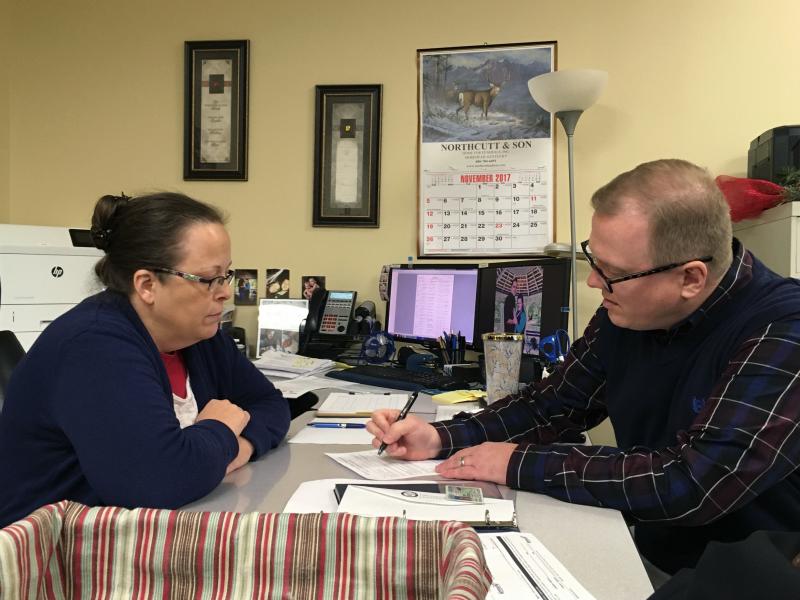David Ermold files to run for Rowan County Clerk as Kim Davis looks on, two years after Davis denied Ermold and his now-husband a marriage license because she was opposed to same-sex marriage. David Ermold files to run for Rowan County Clerk as Kim Davis looks on, two years after Davis denied Ermold and his now-husband a marriage license because she was opposed to same-sex marriage.