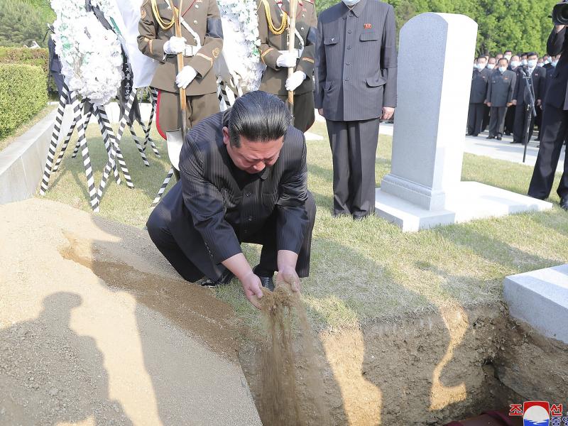 In this photo provided by the North Korean government, North Korean leader Kim Jong Un covers the coffin of Hyon Chol Hae, marshal of the Korean People's Army, with earth at a cemetery in Pyongyang, North Korea Sunday, May 22, 2022. The content of this im In this photo provided by the North Korean government, North Korean leader Kim Jong Un covers the coffin of Hyon Chol Hae, marshal of the Korean People's Army, with earth at a cemetery in Pyongyang, North Korea Sunday, May 22, 2022. The content of this im