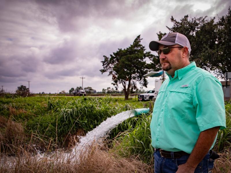 Christian Richard stands next to a groundwater well on his southwestern Louisiana farm. A centuries-old law allows landowners in the state to use as much water as they want for free. Christian Richard stands next to a groundwater well on his southwestern Louisiana farm. A centuries-old law allows landowners in the state to use as much water as they want for free.