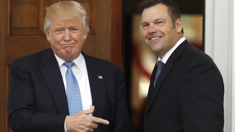 Former Kansas Secretary of State Kris Kobach is greeted by President Trump in 2016 at the Trump National Golf Club Bedminster clubhouse in Bedminster, N.J. Former Kansas Secretary of State Kris Kobach is greeted by President Trump in 2016 at the Trump National Golf Club Bedminster clubhouse in Bedminster, N.J.