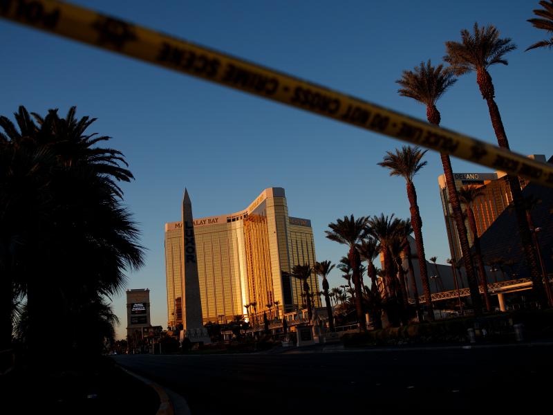 Police tape blocks off part of Las Vegas Blvd. on Tuesday near the scene of a massacre at a country music festival in Las Vegas, Nev. Twelve devices known as bump stocks, allowing a shooter to fire a weapon much more quickly, were found in the gunman's ro Police tape blocks off part of Las Vegas Blvd. on Tuesday near the scene of a massacre at a country music festival in Las Vegas, Nev. Twelve devices known as bump stocks, allowing a shooter to fire a weapon much more quickly, were found in the gunman's ro