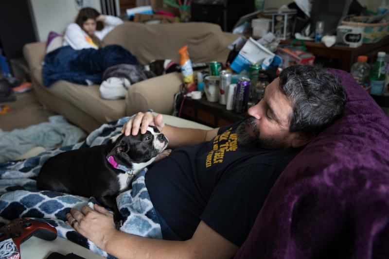 Michael Marquette pets his dog, Spring, while resting at his home in Clarksburg, Md., after a recent hip surgery to repair an injury sustained in 2009 during military duty. Michael Marquette pets his dog, Spring, while resting at his home in Clarksburg, Md., after a recent hip surgery to repair an injury sustained in 2009 during military duty.