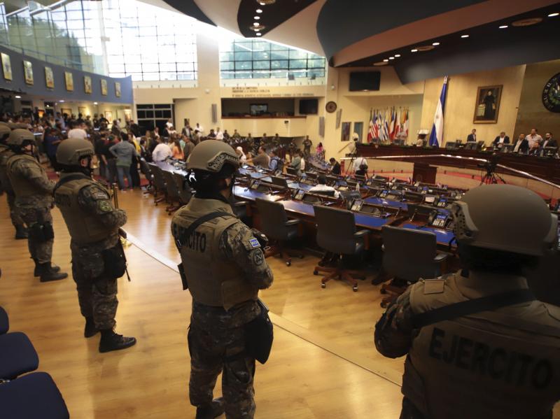 Armed Special Forces soldiers of the Salvadoran Army, following orders of President Nayib Bukele, enter El Salvador's congress during a vote on a security bill on Feb. 9. Armed Special Forces soldiers of the Salvadoran Army, following orders of President Nayib Bukele, enter El Salvador's congress during a vote on a security bill on Feb. 9.