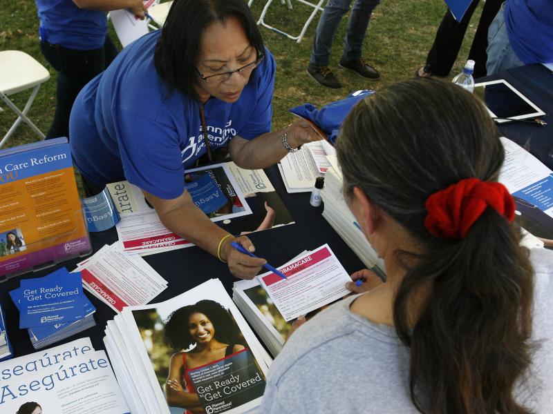 Planned Parenthood worker Alicia Gonzales promotes the Affordable Care Act during an outreach event for the Latino community in Los Angeles in September. Planned Parenthood worker Alicia Gonzales promotes the Affordable Care Act during an outreach event for the Latino community in Los Angeles in September.