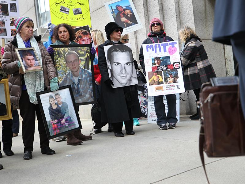 Families that lost loved ones to the opioid crisis protested outside Suffolk Superior Court in Boston as lawyers for Purdue Pharma entered the courthouse for a status update in the Massachusetts attorney general's suit against the company on Jan. 25. Families that lost loved ones to the opioid crisis protested outside Suffolk Superior Court in Boston as lawyers for Purdue Pharma entered the courthouse for a status update in the Massachusetts attorney general's suit against the company on Jan. 25.
