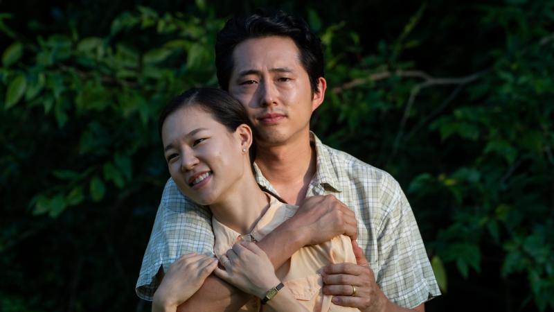 Married couple Jacob and Monica Yi (Steven Yeun and Yeri Han) relocate from California to a farm in Arkansas in the film Minari. Director Lee Isaac Chung says the film was inspired by his own rural upbringing. Married couple Jacob and Monica Yi (Steven Yeun and Yeri Han) relocate from California to a farm in Arkansas in the film Minari. Director Lee Isaac Chung says the film was inspired by his own rural upbringing.