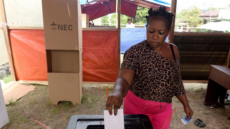 A woman casts her ballot at a polling station in Monrovia, Liberia, as Liberians go to the polls for the second round of presidential elections on Tuesday. A woman casts her ballot at a polling station in Monrovia, Liberia, as Liberians go to the polls for the second round of presidential elections on Tuesday.