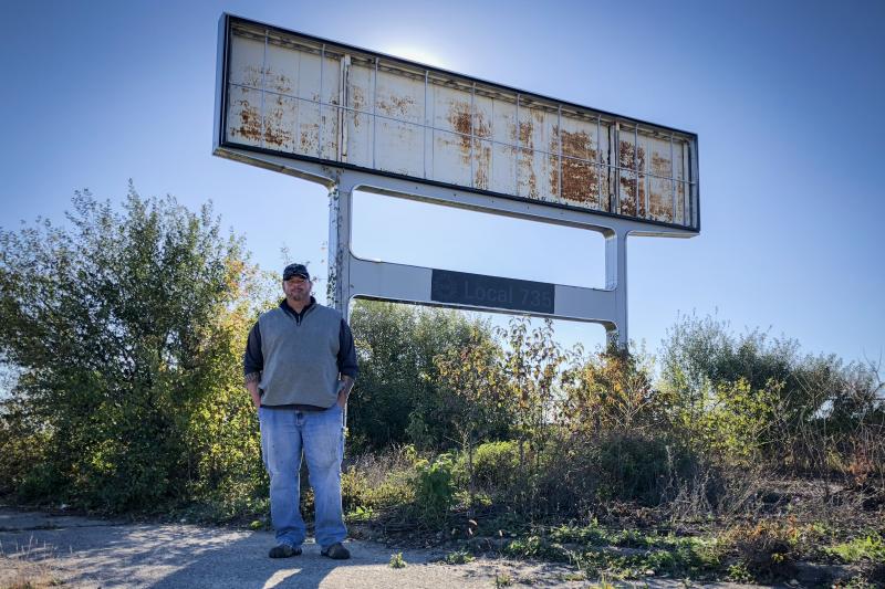 Don Skidmore stands in front of a sign for United Auto Workers Local 735, the union chapter he represented as president when he was a General Motors employee. Don Skidmore stands in front of a sign for United Auto Workers Local 735, the union chapter he represented as president when he was a General Motors employee.