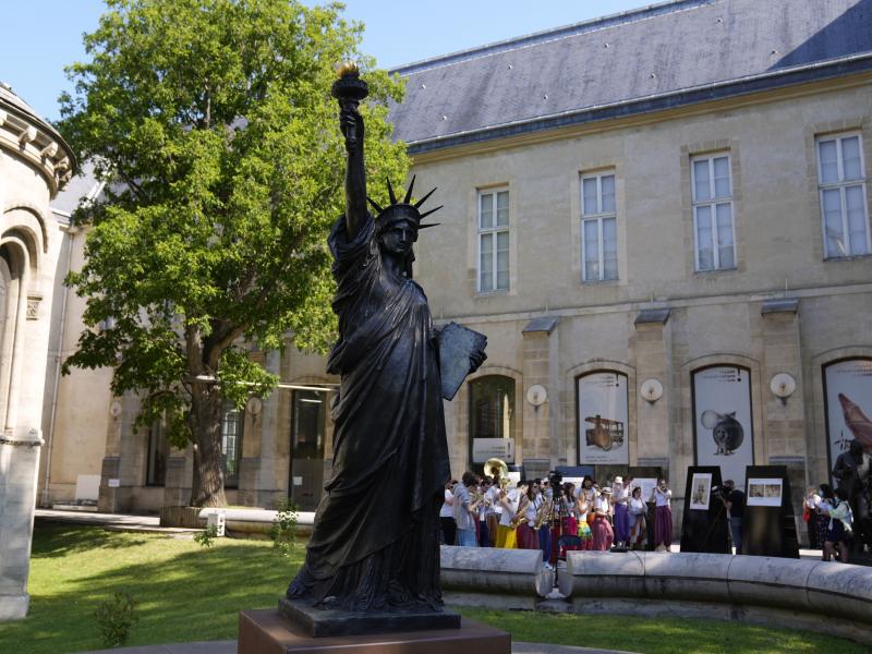 A mini replica of the French-designed Statue of Liberty will reach the U.S. on July 1. Here, the statue awaits its move in Paris on Monday. A mini replica of the French-designed Statue of Liberty will reach the U.S. on July 1. Here, the statue awaits its move in Paris on Monday.