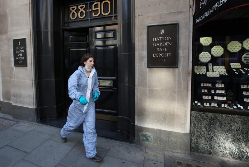 In an elaborate crime that went undetected until Tuesday morning, thieves broke into a safe deposit center used by many jewelers. Here, a woman believed to be a police forensics officer emerges from the building. In an elaborate crime that went undetected until Tuesday morning, thieves broke into a safe deposit center used by many jewelers. Here, a woman believed to be a police forensics officer emerges from the building.