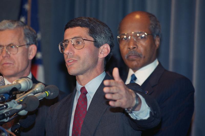 In 1989, Fauci and then-U.S. Health and Human Services Secretary Louis W. Sullivan (right) announced results of studies showing that the antiviral drug AZT had delayed the onset of disease in some people with HIV. In 1989, Fauci and then-U.S. Health and Human Services Secretary Louis W. Sullivan (right) announced results of studies showing that the antiviral drug AZT had delayed the onset of disease in some people with HIV.