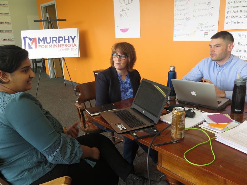 Campaign staff member Aisha Chughtai (left) speaks with Erin Murphy (center), a Democratic candidate for Minnesota governor, at the campaign's St. Paul headquarters as colleague Charles Cox looks on. Chughtai and Cox are members of a newly formed campaign Campaign staff member Aisha Chughtai (left) speaks with Erin Murphy (center), a Democratic candidate for Minnesota governor, at the campaign's St. Paul headquarters as colleague Charles Cox looks on. Chughtai and Cox are members of a newly formed campaign