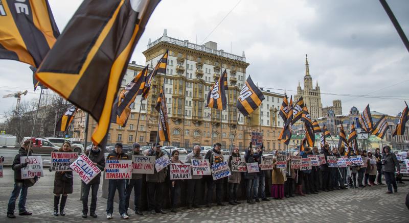 Russian demonstrators hold anti-American posters outside the U.S. Embassy in 2015. From the 1960s through the 1980s, the U.S. said the Soviet Union beamed microwave signals at the U.S. Embassy in an attempt to collect intelligence. Russian demonstrators hold anti-American posters outside the U.S. Embassy in 2015. From the 1960s through the 1980s, the U.S. said the Soviet Union beamed microwave signals at the U.S. Embassy in an attempt to collect intelligence.