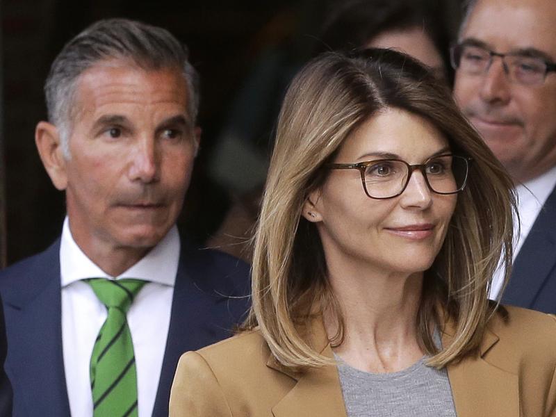 Actress Lori Loughlin and her husband, clothing designer Mossimo Giannulli (left) leave federal court in Boston earlier this month. On Monday they announced they would plead not guilty to charges in the Justice Department's college admissions case. Actress Lori Loughlin and her husband, clothing designer Mossimo Giannulli (left) leave federal court in Boston earlier this month. On Monday they announced they would plead not guilty to charges in the Justice Department's college admissions case.