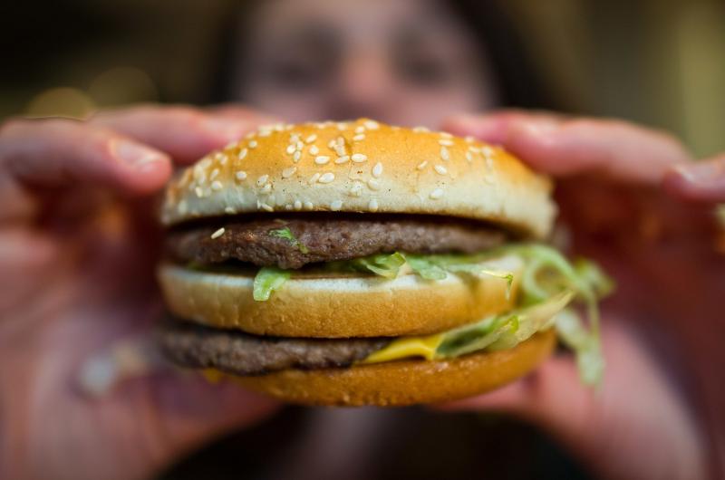 A customer holds a McDonald's Big Mac. The fast-food giant, one of the world's biggest beef buyers, has announced plans to use its might to cut back on antibiotics in its global beef supply. Environmentalists are applauding the commitment. A customer holds a McDonald's Big Mac. The fast-food giant, one of the world's biggest beef buyers, has announced plans to use its might to cut back on antibiotics in its global beef supply. Environmentalists are applauding the commitment.