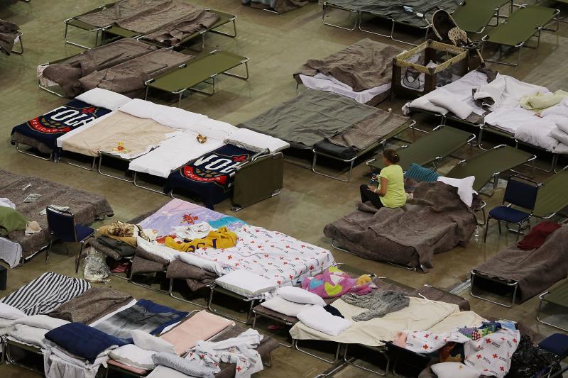 Evacuees sleep in cots on Aug. 19 at the shelter set up at the River Center arena in Baton Rouge, La., as the area deals with the record flooding. Evacuees sleep in cots on Aug. 19 at the shelter set up at the River Center arena in Baton Rouge, La., as the area deals with the record flooding.