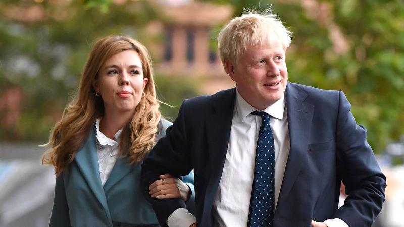 British Prime Minister Boris Johnson and his girlfriend Carrie Symonds at the Conservative Party Conference in 2019. The couple are engaged and expecting their first child. British Prime Minister Boris Johnson and his girlfriend Carrie Symonds at the Conservative Party Conference in 2019. The couple are engaged and expecting their first child.