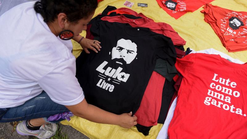 Street vendors display merchandise featuring former Brazilian President Luiz Inácio Lula da Silva, just outside the building in Curitiba where the leader served his prison sentence. Street vendors display merchandise featuring former Brazilian President Luiz Inácio Lula da Silva, just outside the building in Curitiba where the leader served his prison sentence.