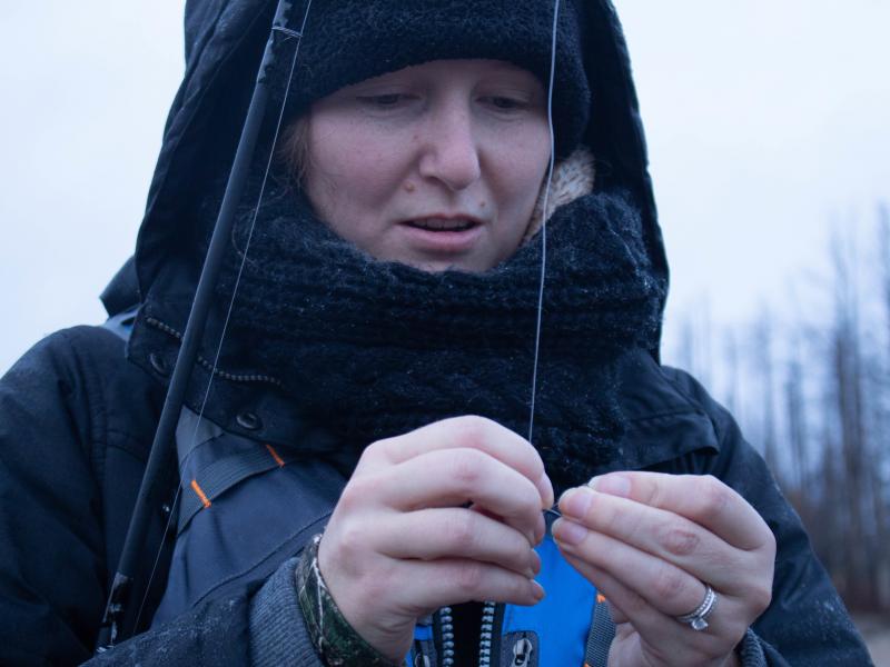 Kristy Taylor baits her hook while fishing on the Two Hearted River in Michigan. She's part of a steelhead fishing class put on by the Michigan Department of Natural Resources in an effort to inspire more women to fish. Kristy Taylor baits her hook while fishing on the Two Hearted River in Michigan. She's part of a steelhead fishing class put on by the Michigan Department of Natural Resources in an effort to inspire more women to fish.
