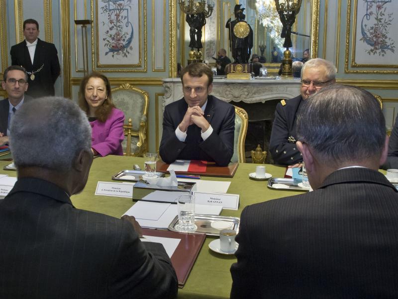 France's President Emmanuel Macron meets with former U.N. Secretary-Generals Kofi Annan (left) and Ban Ki-moon (right) at the Elysee Palace in Paris on Monday. France's President Emmanuel Macron meets with former U.N. Secretary-Generals Kofi Annan (left) and Ban Ki-moon (right) at the Elysee Palace in Paris on Monday.
