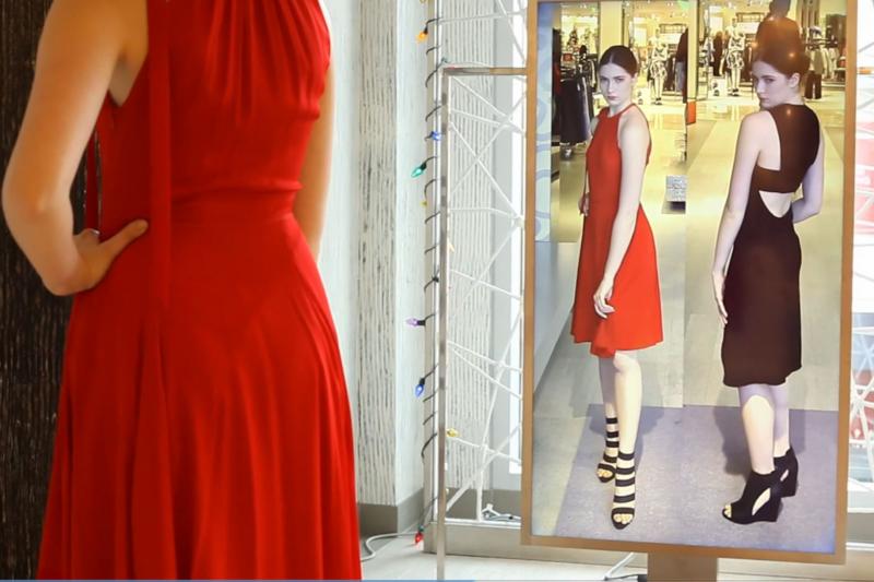 Neiman Marcus is testing a digital "Memory Mirror" that lets shoppers see how an outfit looks in back as well as displaying items they've tried on side by side. Neiman Marcus is testing a digital "Memory Mirror" that lets shoppers see how an outfit looks in back as well as displaying items they've tried on side by side.