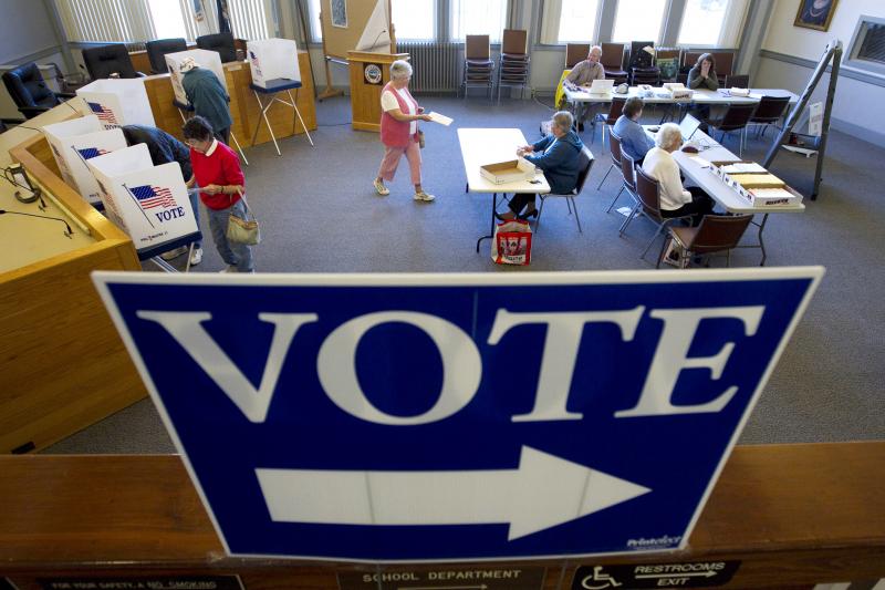 In an Oct. 2012 file photo, voters cast their votes through absentee ballots for the November election in Cape Elizabeth, Maine. Ranked-choice voting will be put to its biggest test when Maine uses the system in a statewide primary election on June 12, th In an Oct. 2012 file photo, voters cast their votes through absentee ballots for the November election in Cape Elizabeth, Maine. Ranked-choice voting will be put to its biggest test when Maine uses the system in a statewide primary election on June 12, th