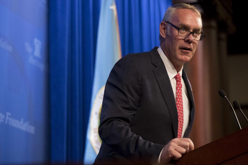 Interior Secretary Ryan Zinke speaks on the Trump administration's energy policy at the Heritage Foundation in Washington in September 2017. Nine of 12 members of the National Park Service advisory board resigned Monday citing Zinke's unwillingness to mee Interior Secretary Ryan Zinke speaks on the Trump administration's energy policy at the Heritage Foundation in Washington in September 2017. Nine of 12 members of the National Park Service advisory board resigned Monday citing Zinke's unwillingness to mee
