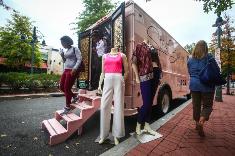 Customers walk out of Street Boutique, parked in Shirlington Village, Va. Street Boutique is a pop-up truck that's similar to the many food trucks in the area, except it sells clothes and jewelry. Customers walk out of Street Boutique, parked in Shirlington Village, Va. Street Boutique is a pop-up truck that's similar to the many food trucks in the area, except it sells clothes and jewelry.