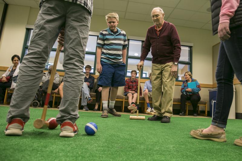 Greg Kintzele, left, and Bill Taylor, right, watch as others play croquet at Graland Country Day School in Denver. Greg Kintzele, left, and Bill Taylor, right, watch as others play croquet at Graland Country Day School in Denver.