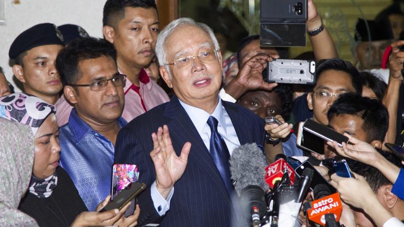 Former Prime Minister Najib Razak speaks during a press conference after being granted bail at a court hearing at Kuala Lumpur High Court in Kuala Lumpur, Malaysia, Thursday. Najib pleaded not guilty Thursday to 25 fresh charges of abuse of power and mone Former Prime Minister Najib Razak speaks during a press conference after being granted bail at a court hearing at Kuala Lumpur High Court in Kuala Lumpur, Malaysia, Thursday. Najib pleaded not guilty Thursday to 25 fresh charges of abuse of power and mone