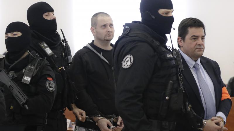 Miroslav Marcek (center) pleaded guilty to carrying out a plot to kill reporter Jan Kuciak and his fiancée. Marian Kocner (right) has denied playing a role in the killings. Miroslav Marcek (center) pleaded guilty to carrying out a plot to kill reporter Jan Kuciak and his fiancée. Marian Kocner (right) has denied playing a role in the killings.