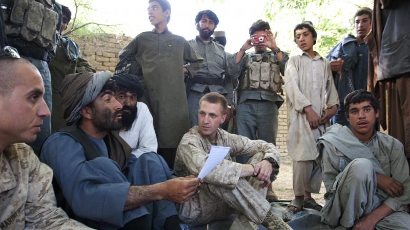 Jason Brezler, seated center, holds a meeting with local governors in Afghanistan in 2010. Brezler faced discharge after emailing classified documents over an insecure network. He challenged the Marine Corps' decision. Jason Brezler, seated center, holds a meeting with local governors in Afghanistan in 2010. Brezler faced discharge after emailing classified documents over an insecure network. He challenged the Marine Corps' decision.