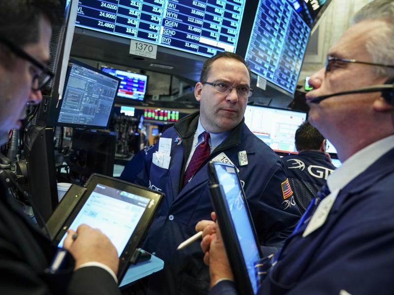 Traders and financial professionals work on the floor of the New York Stock Exchange ahead of the opening bell. Investors' worries about a trade war increased Wednesday after China announced plans to retaliate against U.S. tariffs. Traders and financial professionals work on the floor of the New York Stock Exchange ahead of the opening bell. Investors' worries about a trade war increased Wednesday after China announced plans to retaliate against U.S. tariffs.