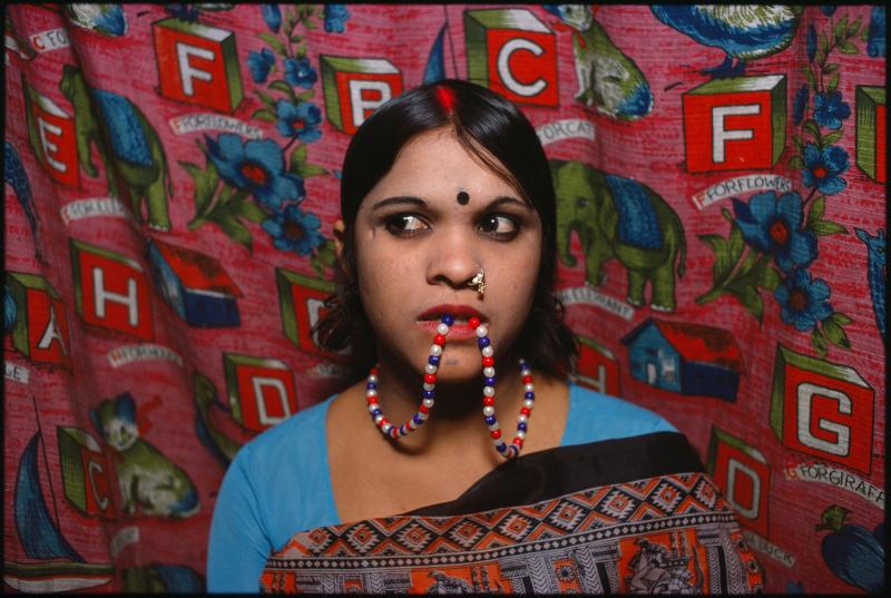 Rekha is one of the many caged prostitutes Mary Ellen Mark came to know as she photographed in the red-light district of Mumbai. Rekha is one of the many caged prostitutes Mary Ellen Mark came to know as she photographed in the red-light district of Mumbai.