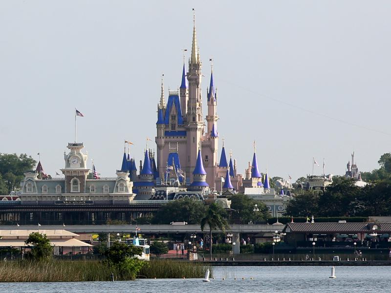Cinderella Castle rises above Bay Lake at the Magic Kingdom at Walt Disney World on Saturday. Disney reopened two of its Florida parks after nearly four months of being closed due to the pandemic. Cinderella Castle rises above Bay Lake at the Magic Kingdom at Walt Disney World on Saturday. Disney reopened two of its Florida parks after nearly four months of being closed due to the pandemic.