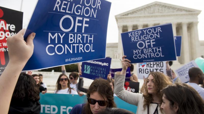 Supporters of women's health rally outside the Supreme Court in Washington, D.C., March 23, 2016, as the Court hears oral arguments in seven cases dealing with religious organizations that want to ban contraceptives from their health insurance policies on Supporters of women's health rally outside the Supreme Court in Washington, D.C., March 23, 2016, as the Court hears oral arguments in seven cases dealing with religious organizations that want to ban contraceptives from their health insurance policies on