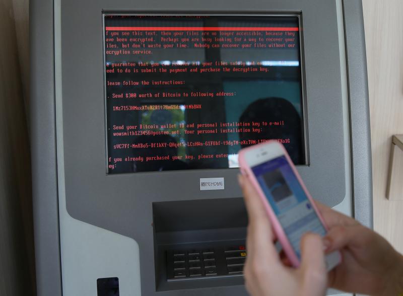 A message demanding money is seen on a terminal monitor at a branch of Ukraine's state-owned Oschadbank after Ukrainian institutions were hit by a wave of cyberattacks earlier Tuesday in Kiev, Ukraine. A message demanding money is seen on a terminal monitor at a branch of Ukraine's state-owned Oschadbank after Ukrainian institutions were hit by a wave of cyberattacks earlier Tuesday in Kiev, Ukraine.