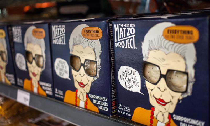Boxes of "Surprisingly Delicious Matzo" made by The Matzo Project line the shelves of Glen's Garden Market in Washington, D.C. Boxes of "Surprisingly Delicious Matzo" made by The Matzo Project line the shelves of Glen's Garden Market in Washington, D.C.
