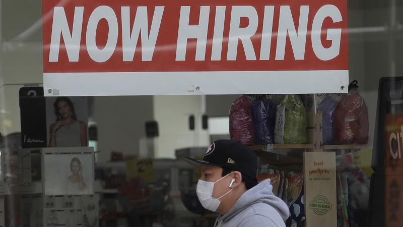 A man walks by a CVS Pharmacy in San Francisco on May 7. U.S. employers unexpectedly added jobs last month as the unemployment rate fell. A man walks by a CVS Pharmacy in San Francisco on May 7. U.S. employers unexpectedly added jobs last month as the unemployment rate fell.