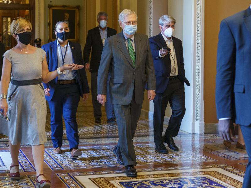 Senate Majority Leader Mitch McConnell of Ky., center, introduced a targeted coronavirus relief bill and said he planned a vote this week on it. Senate Majority Leader Mitch McConnell of Ky., center, introduced a targeted coronavirus relief bill and said he planned a vote this week on it.