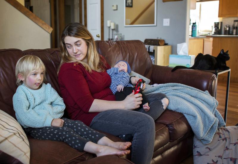 Amber Gorrow and her daughter, Eleanor, 3, pick out a show to watch after Eleanor's nap at their home in Vancouver, Wash., on Wednesday. Eleanor has gotten her first measles vaccine, but Gorrow's son, Leon, 8 weeks, is still too young to be immunized. Amber Gorrow and her daughter, Eleanor, 3, pick out a show to watch after Eleanor's nap at their home in Vancouver, Wash., on Wednesday. Eleanor has gotten her first measles vaccine, but Gorrow's son, Leon, 8 weeks, is still too young to be immunized.
