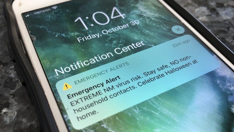 An emergency alert regarding the coronavirus pandemic is displayed on a cellphone Friday in Rio Rancho, N.M. The alert was sent out to New Mexicans across the state urging them to stay home amid a surge in COVID-19 cases and record-high hospitalizations. An emergency alert regarding the coronavirus pandemic is displayed on a cellphone Friday in Rio Rancho, N.M. The alert was sent out to New Mexicans across the state urging them to stay home amid a surge in COVID-19 cases and record-high hospitalizations.