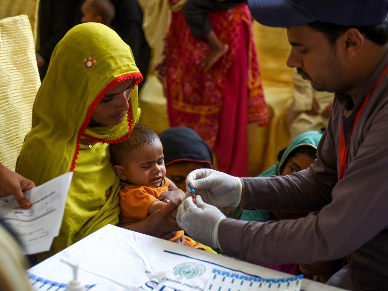 In Larkana, Pakistan, on May 9, 2019, a paramedic takes a blood sample from a baby for a HIV test. The government is offering screenings in the wake of an HIV outbreak. In Larkana, Pakistan, on May 9, 2019, a paramedic takes a blood sample from a baby for a HIV test. The government is offering screenings in the wake of an HIV outbreak.