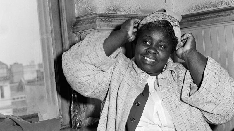 Georgia Gilmore adjusts her hat for photographers in 1956 during the bus boycott trial of Rev. Martin Luther King Jr. in Montgomery, Ala. She testified: "When you pay your fare and they count the money, they don't know the Negro money from white money." Georgia Gilmore adjusts her hat for photographers in 1956 during the bus boycott trial of Rev. Martin Luther King Jr. in Montgomery, Ala. She testified: "When you pay your fare and they count the money, they don't know the Negro money from white money."
