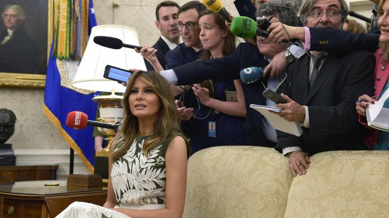 First lady Melania Trump sits on a couch surrounded by reporters as she participates in a meeting with President Trump, Spain's King Felipe VI and Queen Letizia in the Oval Office on Tuesday. First lady Melania Trump sits on a couch surrounded by reporters as she participates in a meeting with President Trump, Spain's King Felipe VI and Queen Letizia in the Oval Office on Tuesday.