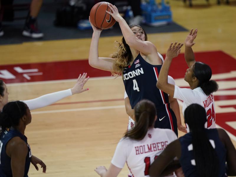 Connecticut guard Saylor Poffenbarger (4) is defended by St. John's guard Danaijah Williams (24) and forward Cecilia Holmberg (11) during the fourth quarter of an NCAA college basketball game in New York last month. The women's NCAA championship begins Su Connecticut guard Saylor Poffenbarger (4) is defended by St. John's guard Danaijah Williams (24) and forward Cecilia Holmberg (11) during the fourth quarter of an NCAA college basketball game in New York last month. The women's NCAA championship begins Su