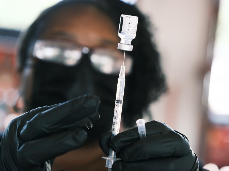 A person prepares to administer a Pfizer COVID vaccine at a clinic in Ferguson, Missouri in August 2021. Merriam-Webster has chosen "vaccine" as the word of the year, citing a sustained surge in lookups. A person prepares to administer a Pfizer COVID vaccine at a clinic in Ferguson, Missouri in August 2021. Merriam-Webster has chosen "vaccine" as the word of the year, citing a sustained surge in lookups.