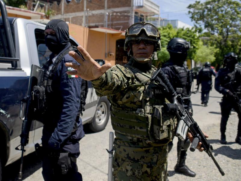 Mexican navy members and federal police take part in an operation in Acapulco in the state of Guerrero, Mexico, on Tuesday to disarm local police. Mexican navy members and federal police take part in an operation in Acapulco in the state of Guerrero, Mexico, on Tuesday to disarm local police.