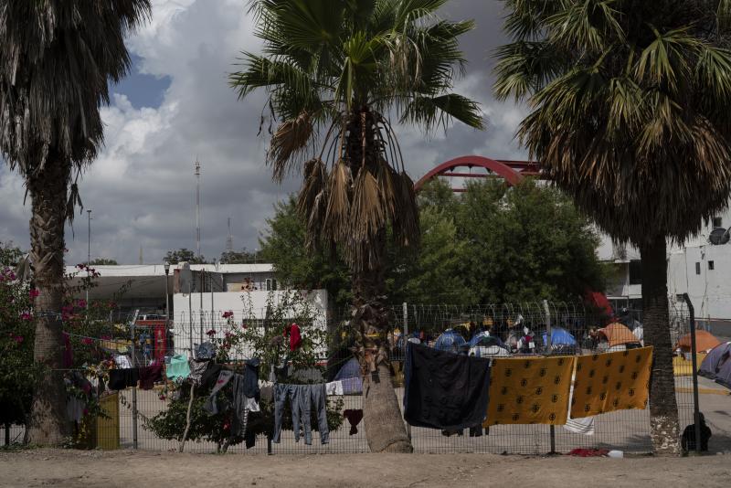 Drying migrants clothes in an encampment near the Gateway International Bridge in Matamoros, Tamaulipas. More than 1,500 asylum-seekers are living in the tent encampment. Drying migrants clothes in an encampment near the Gateway International Bridge in Matamoros, Tamaulipas. More than 1,500 asylum-seekers are living in the tent encampment.