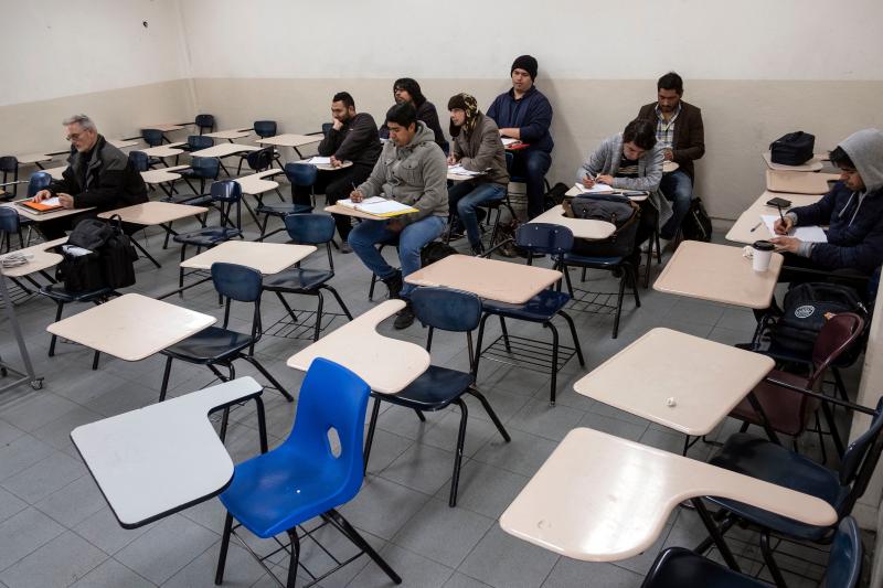 Male students attend to class during at the Universidad Autonoma de Baja California in Tijuana. Women were largely absent from classes in photos posted on social media. Male students attend to class during at the Universidad Autonoma de Baja California in Tijuana. Women were largely absent from classes in photos posted on social media.